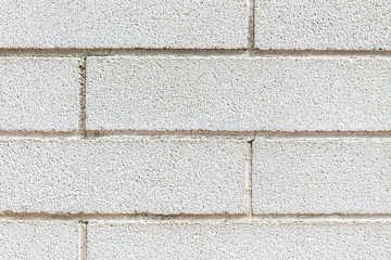 Fototapeta premium A white wall full of bricks