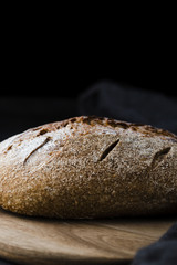 Front view of bread on chopeper with black background