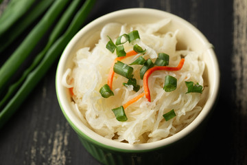 Sauerkraut salad in bowl, cabbage, onion, carrot