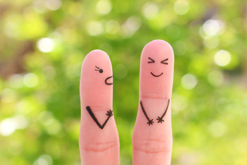 Fingers art of family during quarrel. Concept of wife shouts on husband, man laughs.