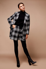 Beautiful sexy young business woman dark hair evening makeup wearing formal suit jacket short cell...