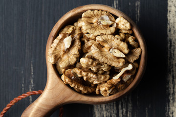 Walnuts kernels in  wooden bowl
