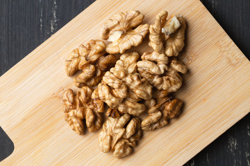 Walnuts brain, nut kernels  on wooden board