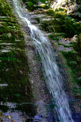 Waterfall from ravine.waterfall from the mountain river. rapid current