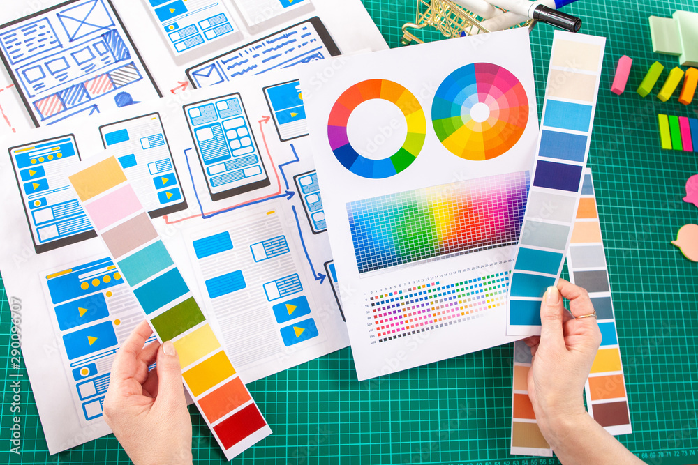 Poster the girl works as a designer of mobile applications. selection of the most successful color solution