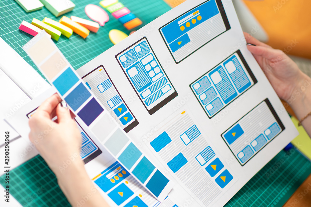 Poster the girl works as a designer of mobile applications. color matching for designed dialog boxes. user-