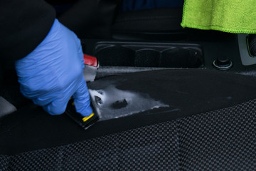 dry cleaning of a car seat with chemicals, closeup view