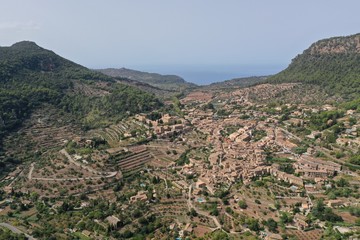 Fototapeta na wymiar valldemosa village drone aerial photography famous places mallorca island vacations luxury mountains landscape aerial view panoramic mediterranean relaxing beautiful 