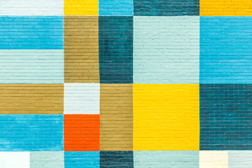  brick wall painted in rainbow colors - obrazy, fototapety, plakaty