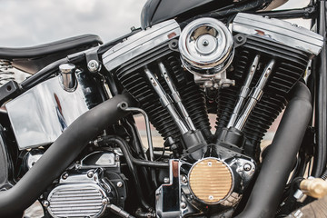 Fototapeta na wymiar V-shaped bike engine with chrome parts - customized motorcycle