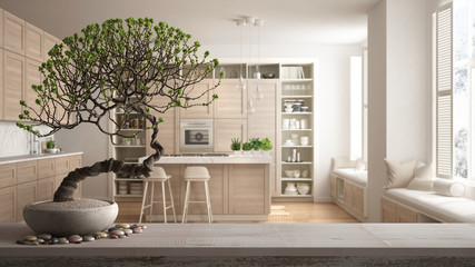 Vintage wooden table shelf with pebble and potted bloom bonsai, white flowers, over minimalist white and wooden kitchen, modern interior design, zen clean architecture concept idea