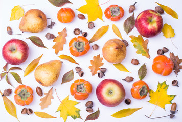 Freshly picked fall fruits as a pattern with yellow leaf.