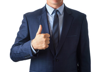 Young man in blue suit holds thumb up, isolate on white background
