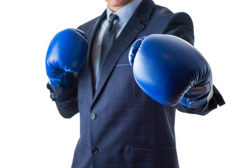 Young man in a suit and blue boxing gloves, isolated on white background