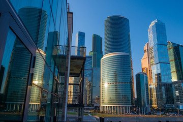 Reflections of skyscrapers in glass buildings