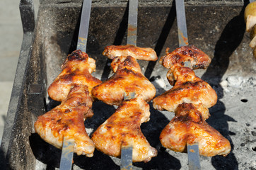 Cook barbecue on the coals.Chicken kebab on a spit.