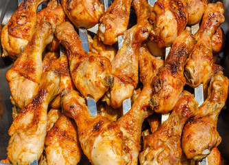 Barbecue of fried chicken legs.