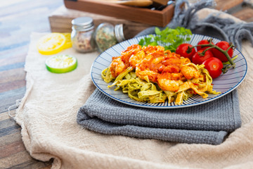 Small Gambas, stewed tomatoes, Tagliatelle with pesto