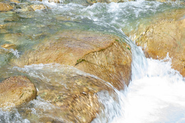 Waterfall from ravine.waterfall from the mountain river. rapid current