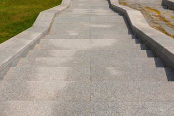 Obraz premium Granite tiled stone stairway leading down the street