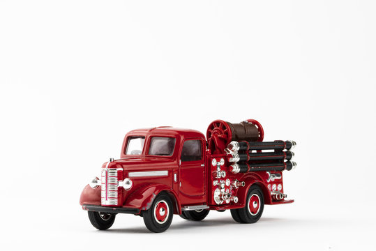 vintage red fire truck toy on white background