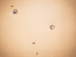 Beach and ocean during summer vacation day with tourists and people enjoying - beautiful aerial view of nature outdoors - tropical scenic travel concept in wild coasts