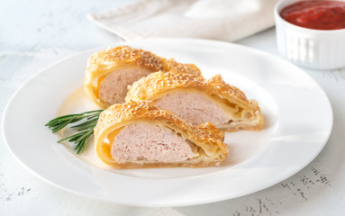 Sausage rolls with tomato sauce