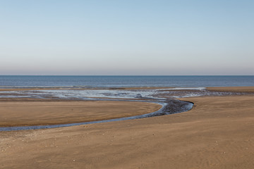 Fototapeta na wymiar The beach at low-tide at Villers-sur-Mer, Normandy, France