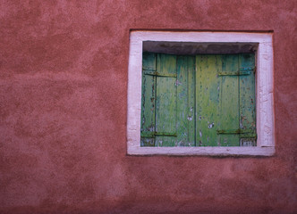 Old vintage green window in Venice, Italy.