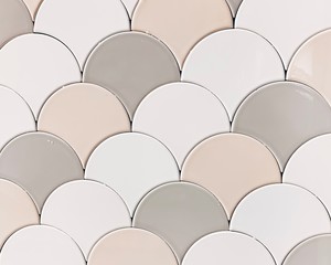 real photo of white, beige gray tiles Seamless surface design with fish scales ornament. Oriental traditional pattern with repeated mosaic. Tracery window wallpaper.  © Алена Ган