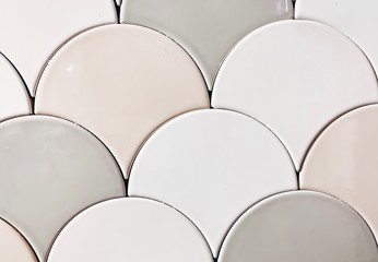 real photo of white, beige gray tiles Seamless surface design with fish scales ornament. Oriental traditional pattern with repeated mosaic. Tracery window wallpaper.  © Алена Ган