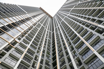 Nonthaburi ,Thailand. -AUGUST 07, 2019  Modern condo building in Nonthaburi - wide angle view from below of a concrete  city tower.
