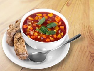 Bowl of delicious vegetables soup on  table