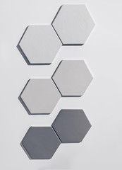 real photo:  set of white gray and black hexagonal tiles wall  on white background