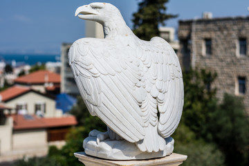 Fototapeta premium Eagle stone statue in Bahai Gardens in Haifa, Israel