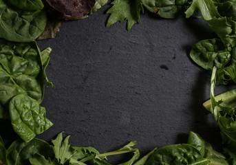 Lettuce leaves on a slate cutting board fresh green healthy eating