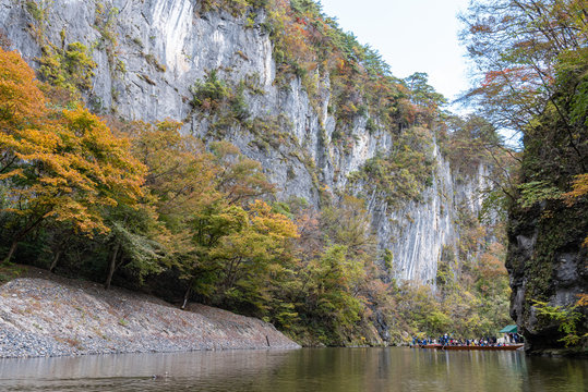 Geibikei Gorge River Cruises in Autumn foliage season. Beautiful scenery landscapes view in sunny weather day. Ichinoseki, Iwate Prefecture, Japan