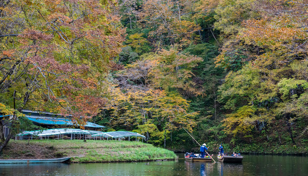 Geibikei Gorge River Cruises in Autumn foliage season. Beautiful scenery landscapes view in sunny weather day. Ichinoseki, Iwate Prefecture, Japan
