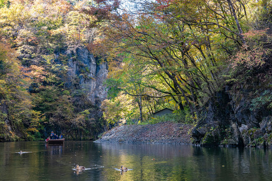 Geibikei Gorge River Cruises in Autumn foliage season. Beautiful scenery landscapes view in sunny weather day. Ichinoseki, Iwate Prefecture, Japan