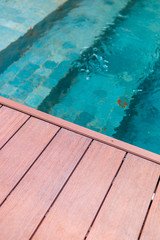 swimming pool with fresh water and wood porch
