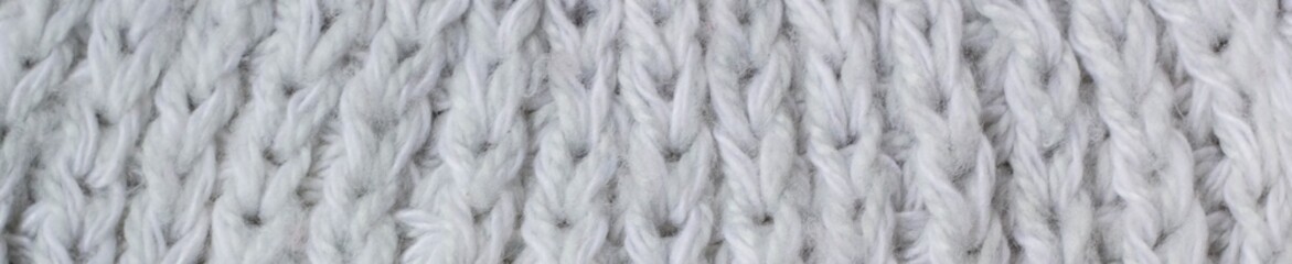 banner of Sweater or scarf Pattern Of White Knitted Fabric Texture Background