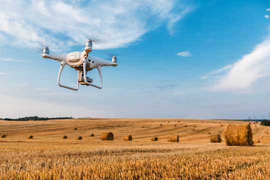 drone quad copter on yellow field