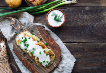 Potato pancakes with dill on rustic wooden cutting board