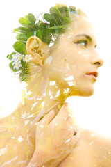 Double exposure of a healthy natural beauty's profile combined with bright green tropical leaves