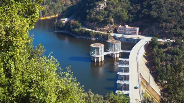 Vilanova de Sau, Catalonia / Spain. A car crossing by the dam at Sau Reservoir