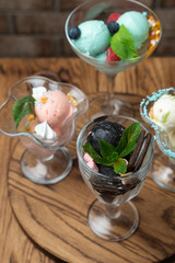 Close up of summer ice cream desserts with sweet toppings