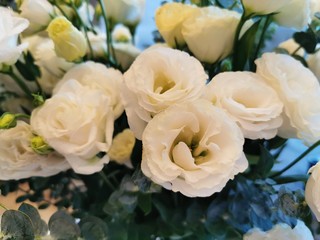 wedding rings on a bouquet of flowers