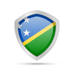 Fototapeta premium Shield with Solomon Islands flag on white background.