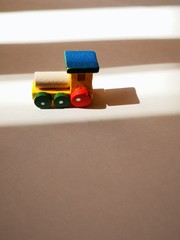 Fototapeta premium Color and wooden toy train on white background