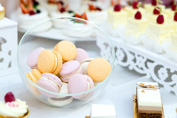 Tasty desert sweet macarons on wedding, close up.